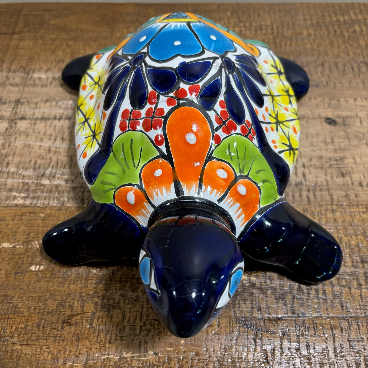 Front-top view blue hand-painted Ceramic Talavera Mexican pottery turtle statue floral motif turtle shell figure. Available for sale through purchase online.