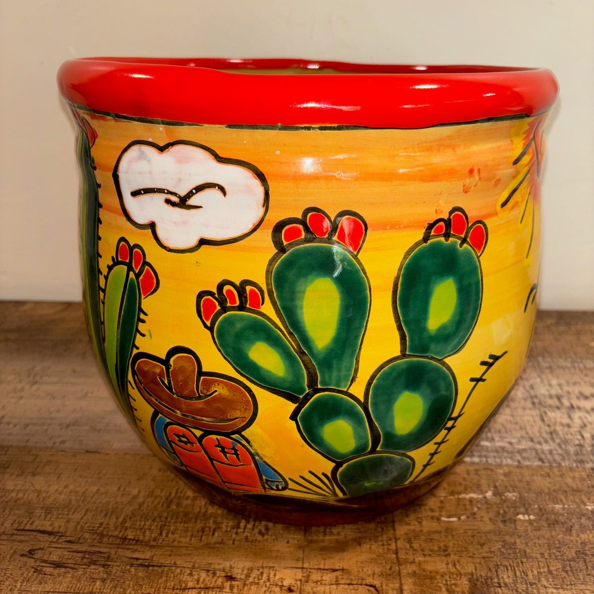 Side view Hand-made Hand-painted colorful Talavera pottery Ranchero theme Cactus design with sleeping cowboy, from Mexico, for sale online.